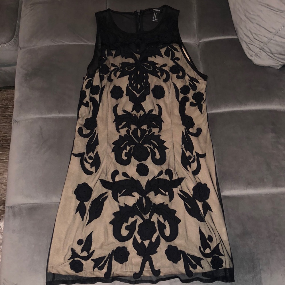 Cream dress with black mesh pattern over